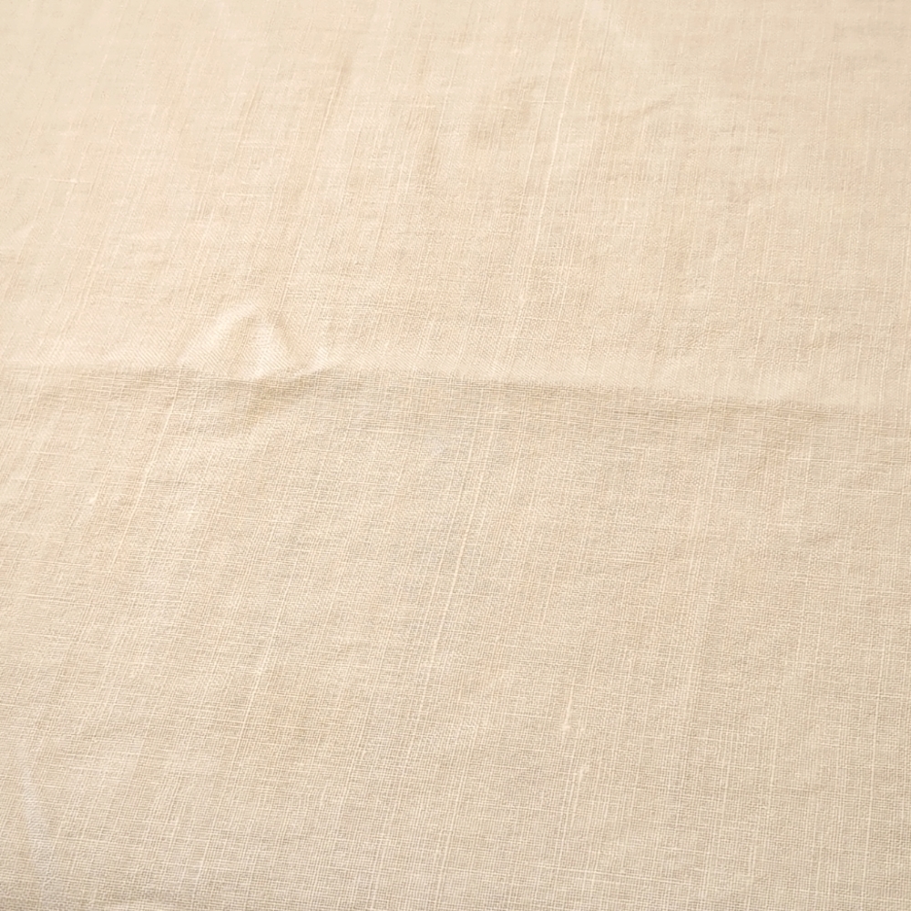 Tablecloth off-white linen 52x100" narrow beige satin trim on scalloped edge.